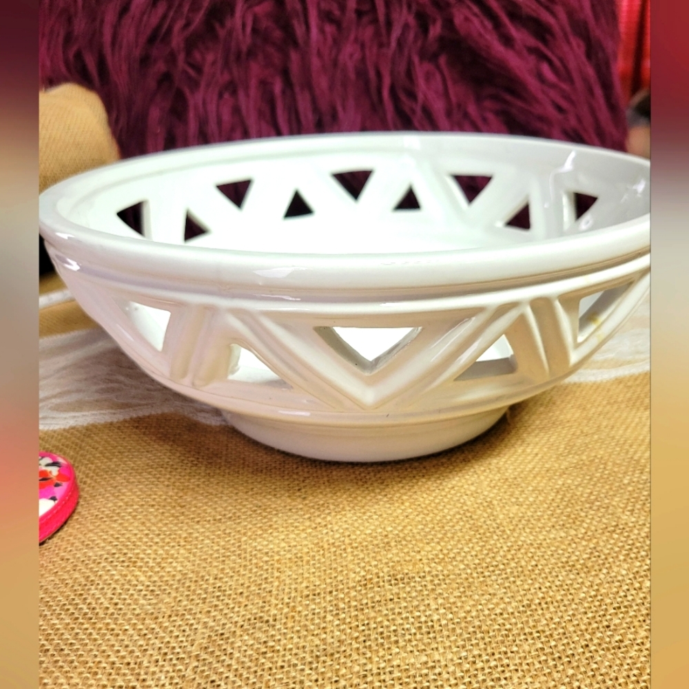 Ceramic cut out bowl does not include the balls